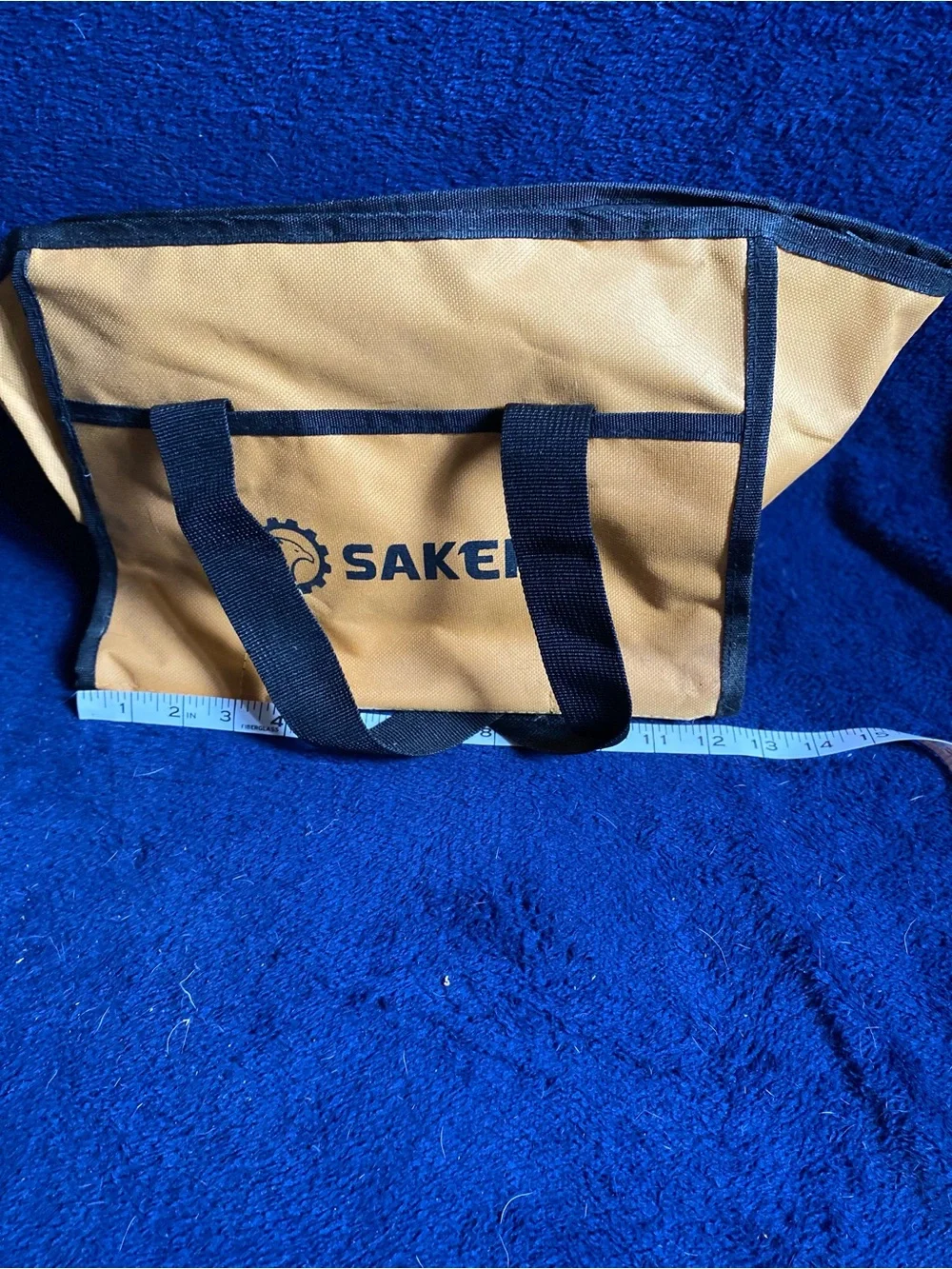 Small gold and black tool bag with safety glasses- Saker